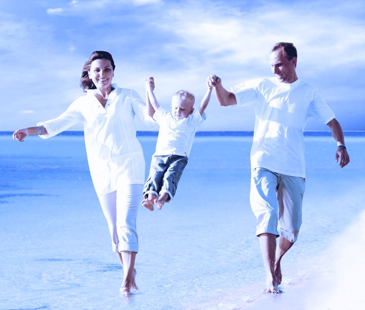 Family walking on the beach